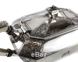 Durgin Sterling Silver Coffe & Tea Service Set, circa 1890. Hand Chased
