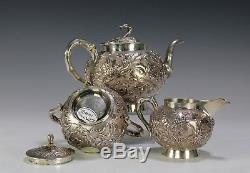 Nice Three Piece Chinese Export Silver Tea Set With Relief Flowers
